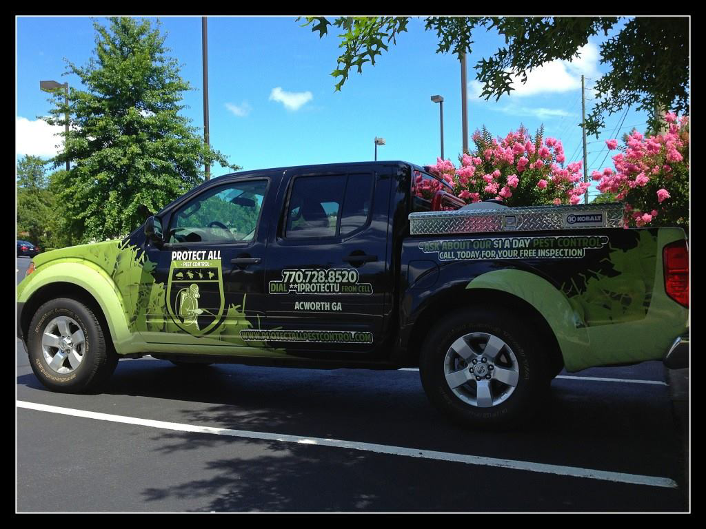 A branded Protect All Pest Control truck parked in Acworth, GA, ready for wildlife and pest control services.