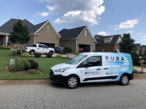 Pura Pest Control van parked at a client's home, ready for service in Greenville, SC