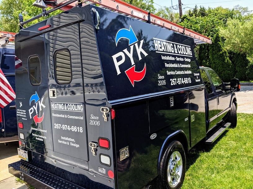 A branded PYK HVAC service truck with ladders, ready for residential and commercial jobs in Philadelphia, PA.