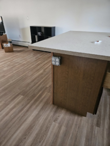 A newly installed quad electrical outlet on a kitchen island by The Alaskan Electricians in Anchorage, AK.