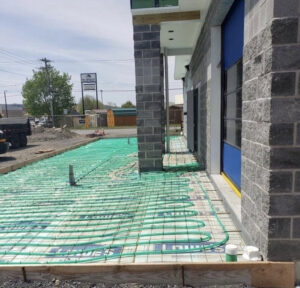 Radiant floor heating tubes laid out on a construction site before concrete pour by Allied Heating and Air Conditioning in Port Richey, FL.
