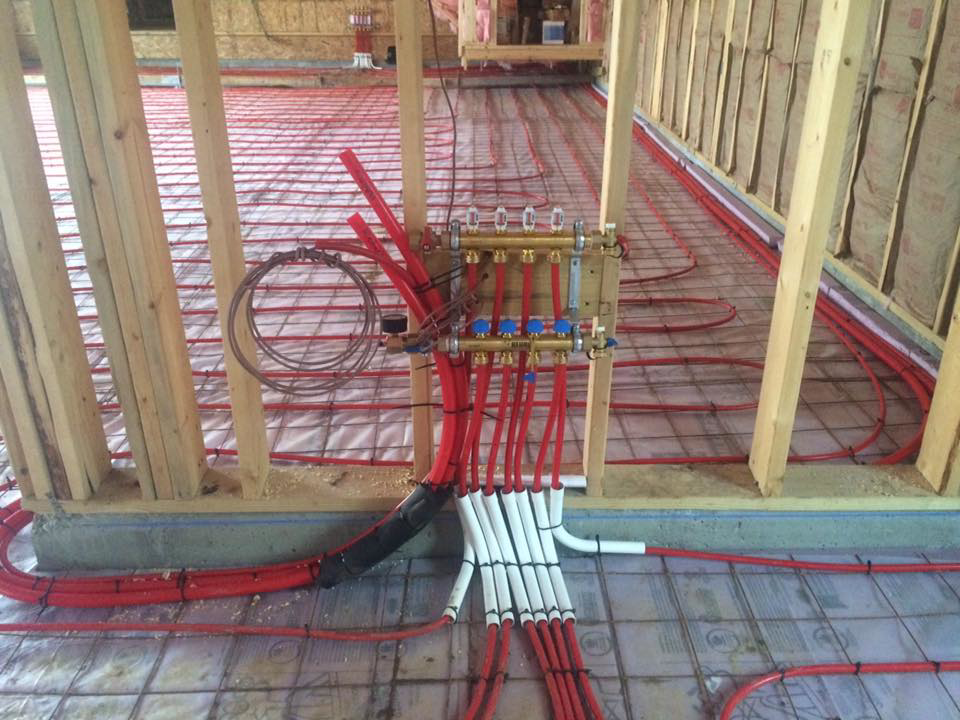 Radiant floor heating PEX tubing and manifold system being installed by Gil-Rich Cooling & Heating LLC in Flint, MI