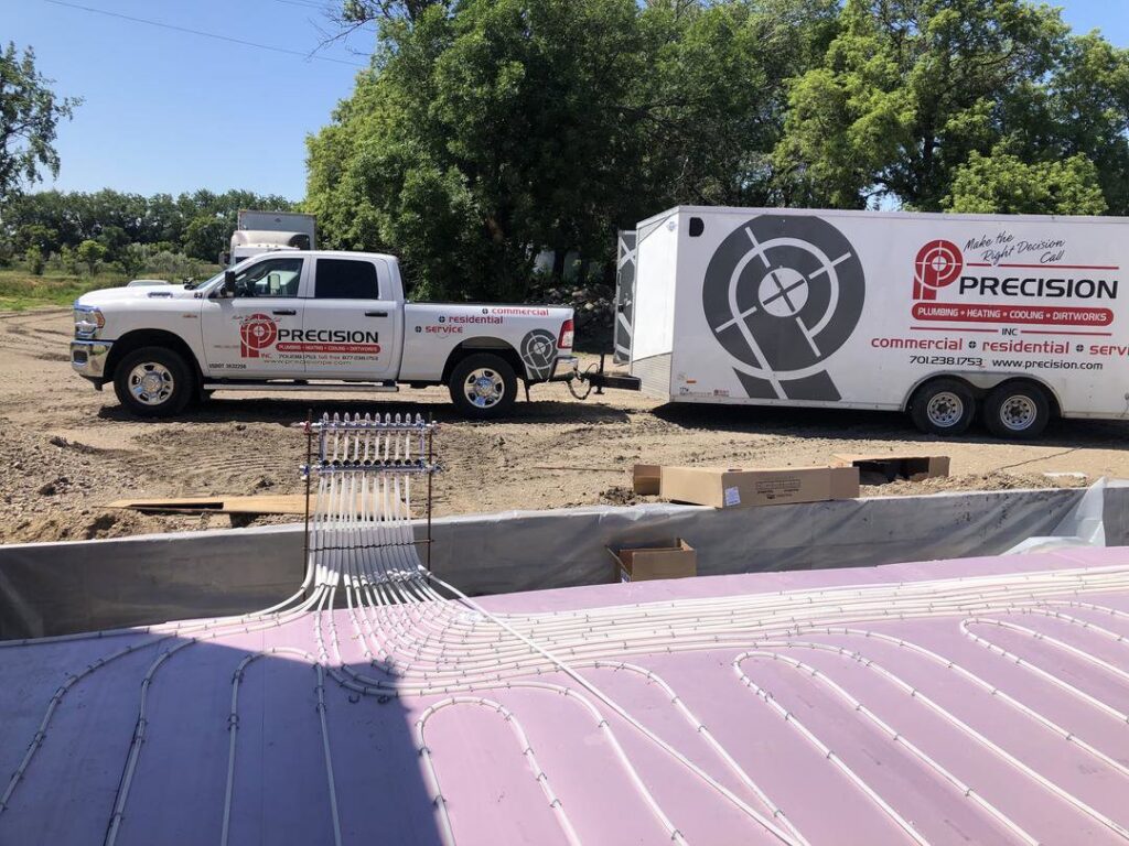 Radiant floor heating pipes being installed at a construction site by Precision Heating & Air Conditioning in Royersford, PA