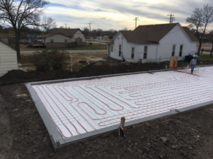 Radiant floor heating tubes being installed on a new foundation by Summit Heating & Air Conditioning in White Bear Lake, MN.