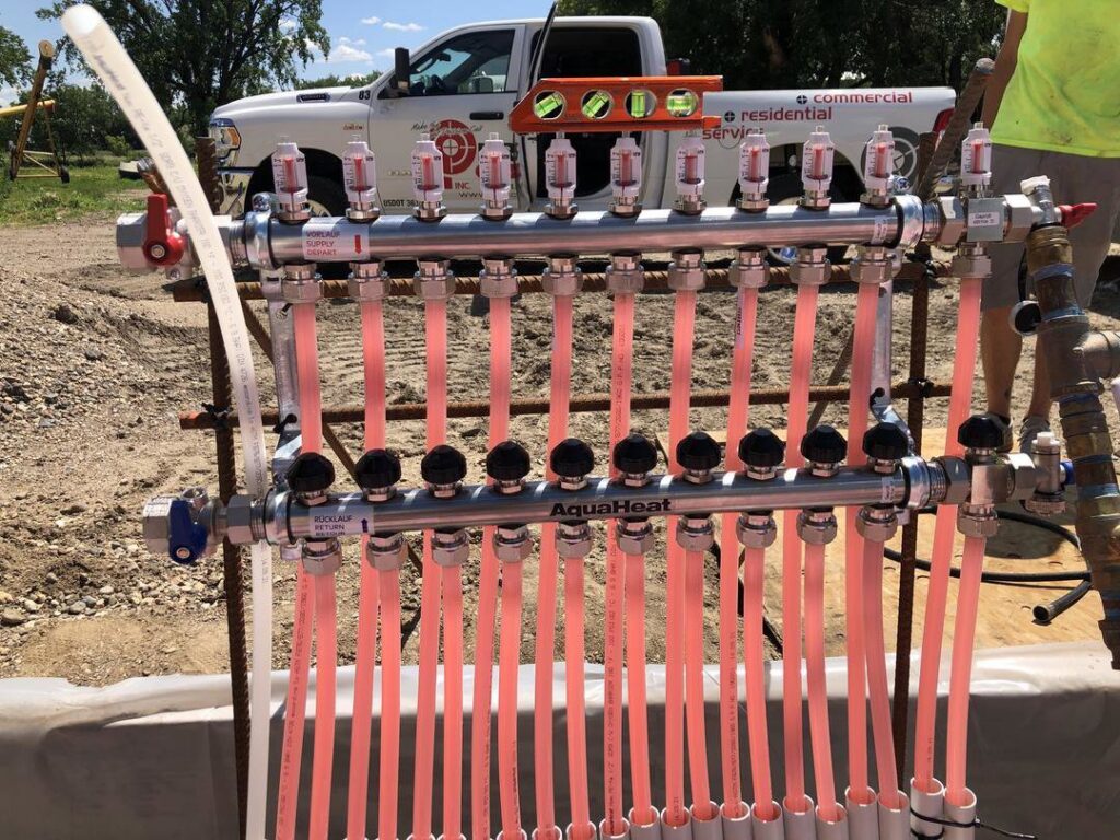 A close-up of a radiant floor heating manifold installation by Precision Heating & Air Conditioning in Royersford, PA