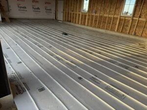 A pattern of radiant floor heating pipes installed on insulation in a new home by Dischler Heating-Cooling & Fireplaces in Prairie du Sac, WI.