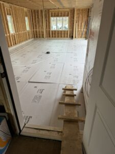 Radiant floor heating pipes installed on insulation in a new construction home by Dischler Heating-Cooling & Fireplaces in Prairie du Sac, WI.