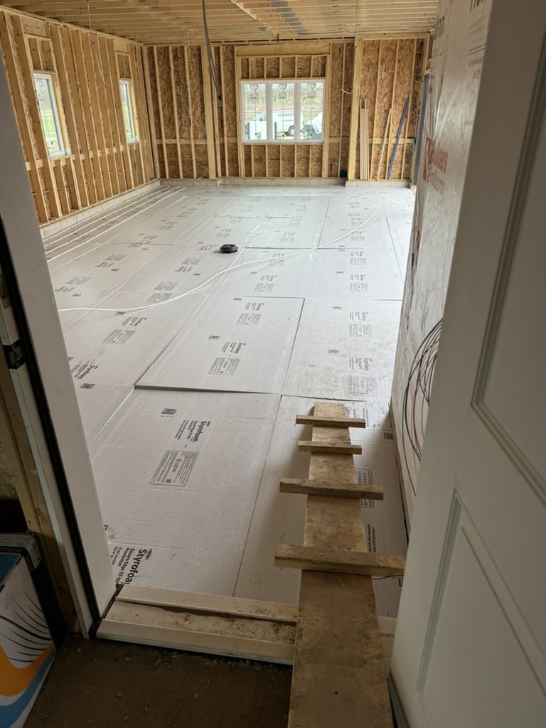 Radiant floor heating pipes installed on insulation in a new construction home by Dischler Heating-Cooling & Fireplaces in Prairie du Sac, WI.