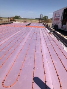 Radiant floor heating pipes laid out on insulation during an installation by Precision Heating & Air Conditioning in Royersford, PA
