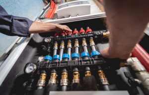Close-up of a radiant heating or cooling manifold system being serviced by Chapman Air and Heat in Dallas, TX