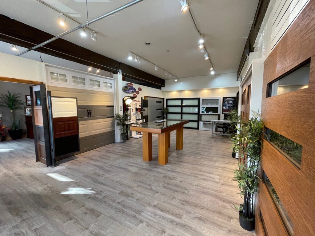 An expansive view of the Rainier Garage Door showroom, showcasing various garage door models and options in Bellevue, WA.