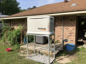 A Generac generator installed on a raised platform next to a home by Optimize Generator People in Baton Rouge, LA.