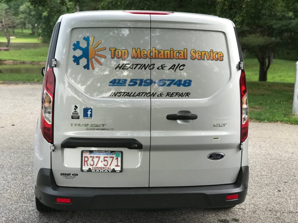 Rear view of a branded HVAC service van for Top Mechanical Service, ready for service calls in East Longmeadow, MA.