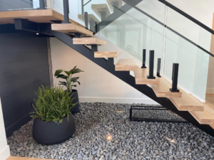 Recessed floor lighting illuminating a modern staircase, expertly installed by Outlaw Electric in Tulsa, OK.