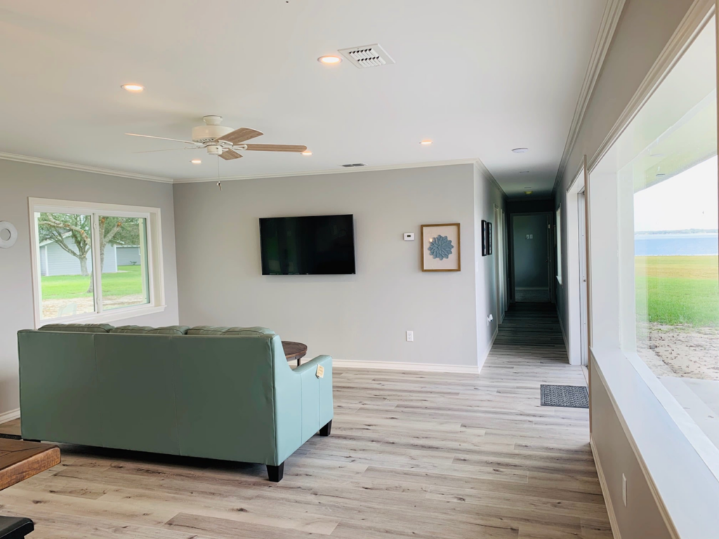 Living room with new recessed lighting and a ceiling fan installed by Chuck's Electric and Construction in Corpus Christi, TX