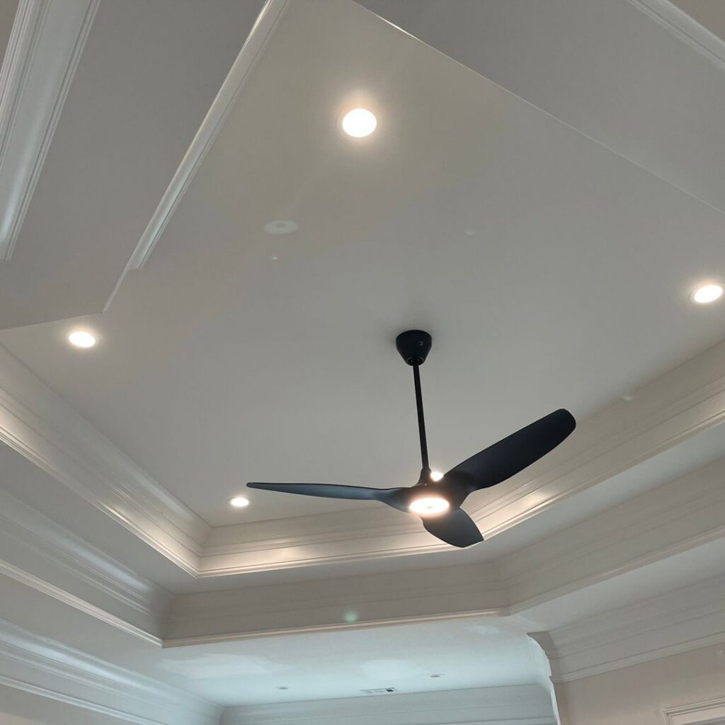 Modern ceiling with recessed lighting and a ceiling fan installed by J&M Electrical Services in Stockbridge, GA.