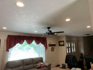 A living room featuring newly installed recessed lighting and a ceiling fan by JR Electric in Saint George, UT.