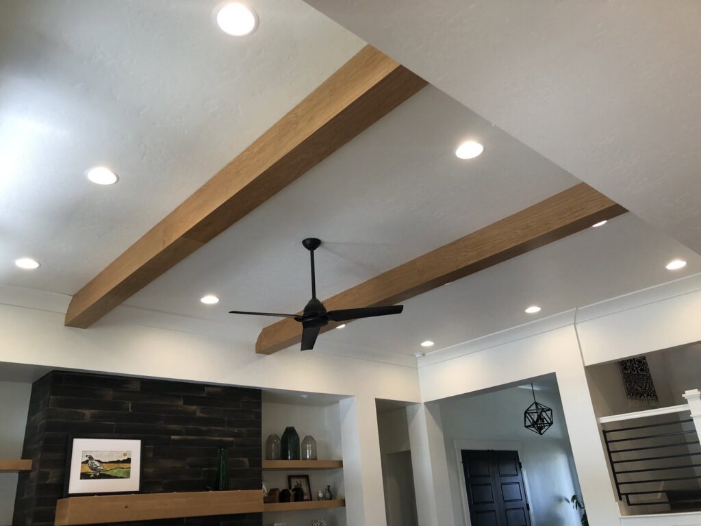 Newly installed recessed lighting and a modern ceiling fan, showcasing electrical work by Veritas Electric in Yalaha, FL.
