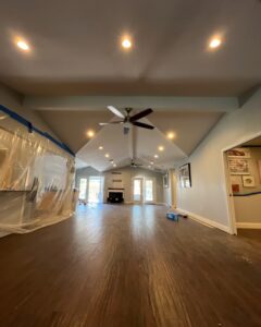A spacious room featuring newly installed recessed lighting and ceiling fans, completed by Volt-Pro Electric, LLC in Houston, TX
