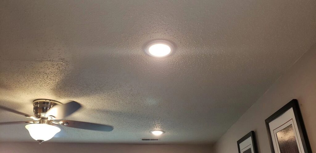 Recessed lighting and a ceiling fan installed in a modern living space by ZAP Electric LLC in Greeley, CO.