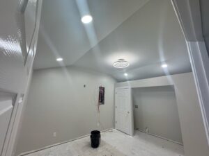 Recessed lighting and an open electrical panel with wiring in a room, showing work by Delta Current Electric in Jonesboro, AR.