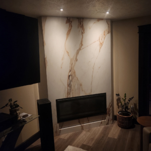 Professional recessed lighting installation above a modern fireplace by OCD Electric in Spokane, WA.