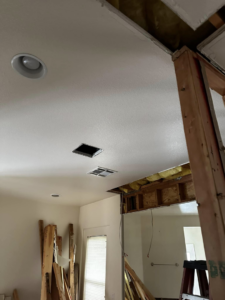 Recessed lighting and ventilation vents installed in a ceiling during a renovation project by Break-N-Run Services in Henderson, NV.