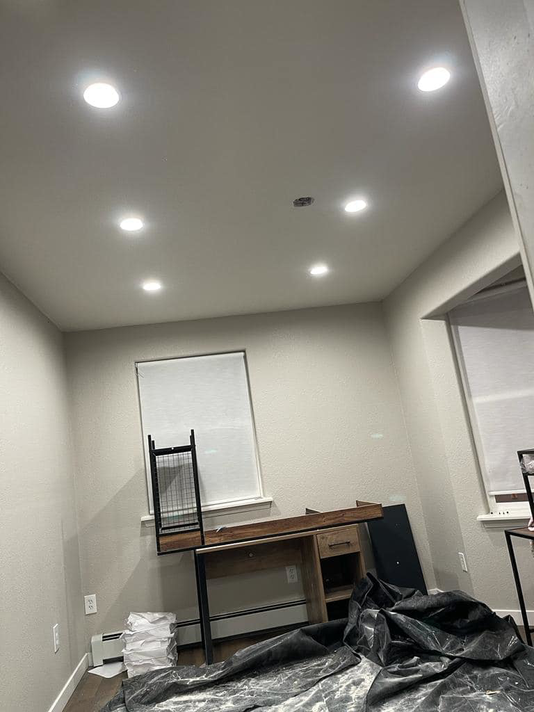 A room featuring newly installed recessed lighting in the ceiling, completed by Jimenez Electric Inc in Denver, CO.