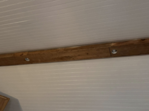 Recessed lighting fixtures installed in a ceiling with wooden beams by Power House Electrical LLC in Johnson City, TN