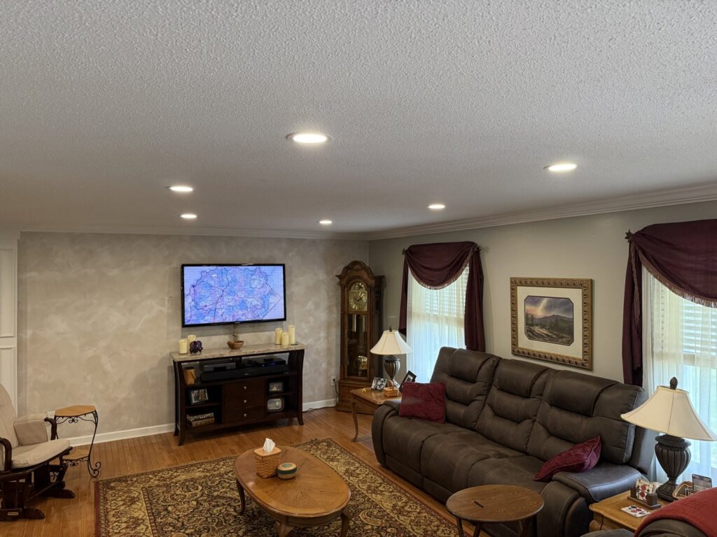 Recessed lighting installation in a living room by Power'd Up Electric, LLC in Clinton, TN.
