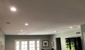 A room with newly installed recessed lighting in the ceiling, completed by Prime Electric in Bellevue, WA.