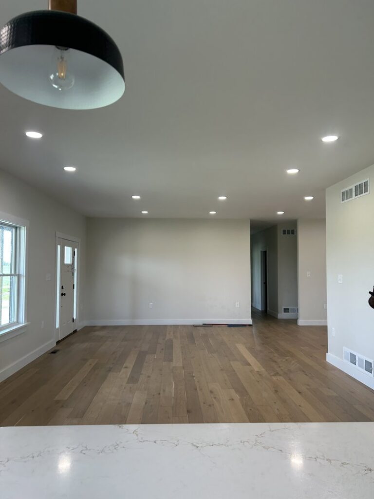 A finished room featuring multiple recessed lights installed in the ceiling, showcasing work by Superior Electrical Solutions llc in Clear Spring, MD.