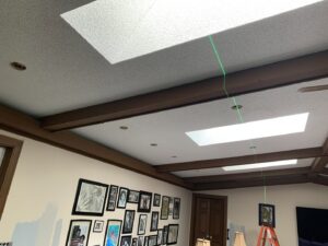 Electrical layout for recessed lighting installation using a laser level by Oak Electric LLC in Waterford, MI.