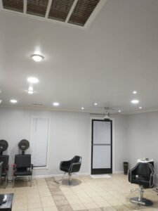 A room with multiple recessed lights and a ceiling fan installed by J3 Services in Goose Creek, SC.