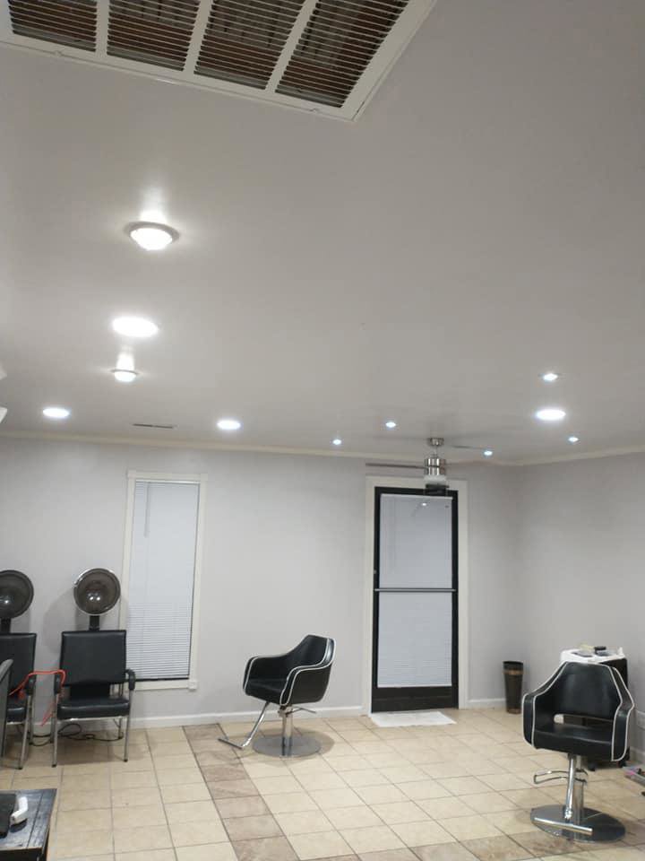 A room with multiple recessed lights and a ceiling fan installed by J3 Services in Goose Creek, SC.