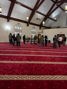 A vibrant red patterned masjid carpet expertly installed by Musalla Masjid Carpets in Glendale Heights, IL.