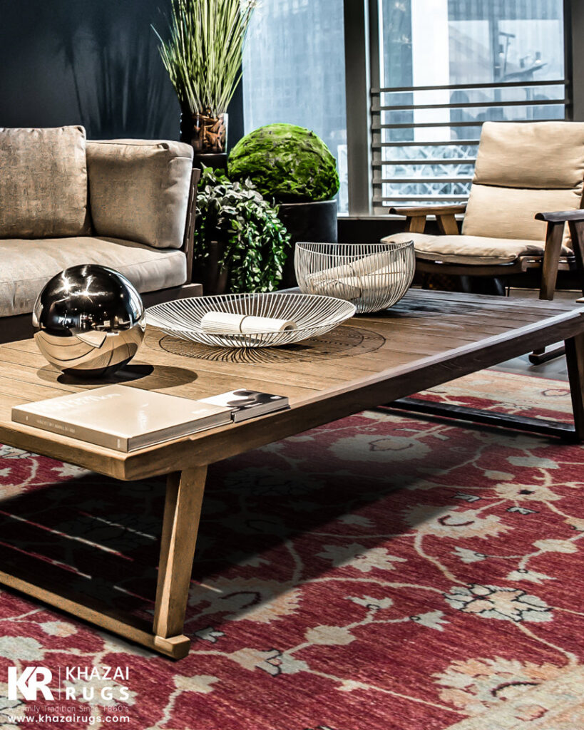 A vibrant red patterned area rug enhancing a stylish living space by Khazai Rugs in Lexington, KY
