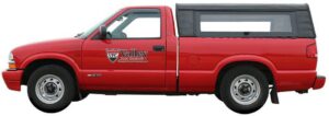 A red pest control truck with the Valley Pest Control logo, ready for service in Oshkosh, WI.
