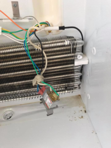 Electrical repair inside a refrigeration unit by Southern Electrical Services in Houma, LA