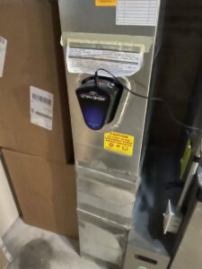 A REME HALO air purification system installed on ductwork by ICare Heating & Air in Millcreek, UT.