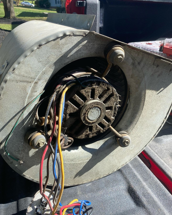 A removed HVAC blower motor assembly ready for repair or replacement by B & H Heating and Air Services LLC in Local City, ST.