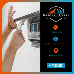 Hands replacing a filter in an indoor mini-split AC unit by Comfort Breeze HVAC Refrigeration in Mobile, AL.
