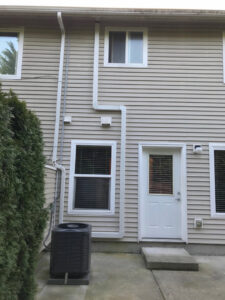 A residential air conditioning unit installed outside a home by Columbia Heating & Air Conditioning in Kent, WA.