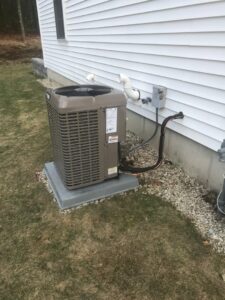 A residential outdoor air conditioning unit installed by Quality Comfort Inc. in Aston, PA
