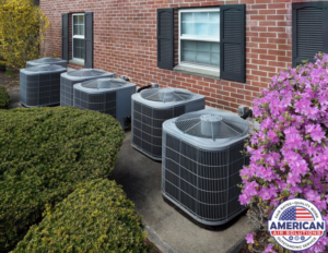 A row of outdoor residential air conditioning units installed alongside a brick house, maintained by American Air Solutions in Summerville, SC.