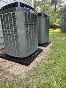 Two outdoor residential air conditioning units installed by EZ Comfort Air Conditioning & Heating LLC in Humble, TX.