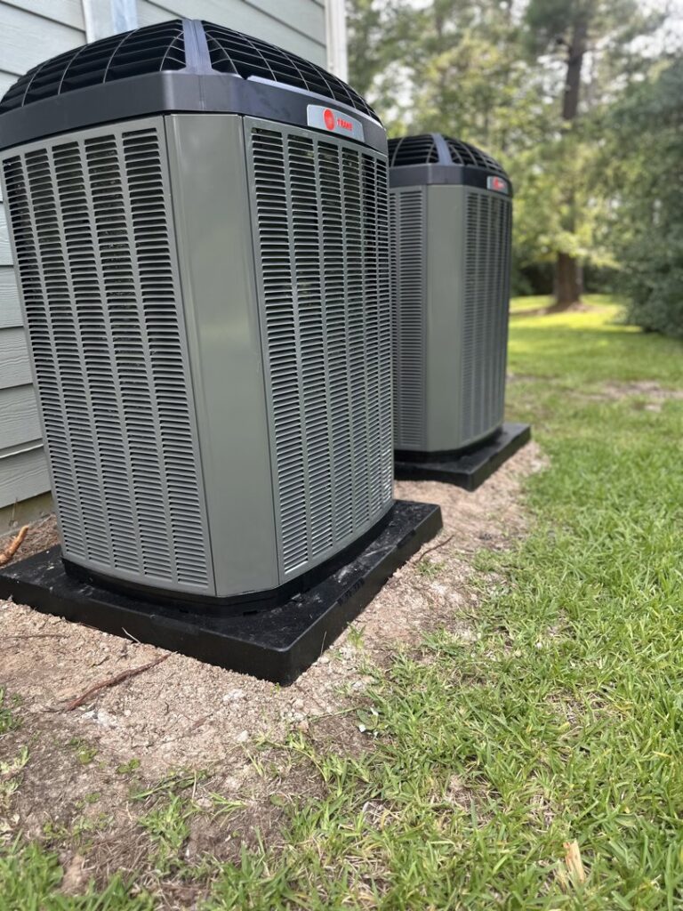 Two outdoor residential air conditioning units installed by EZ Comfort Air Conditioning & Heating LLC in Humble, TX.