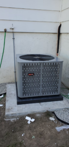 A new residential outdoor air conditioning unit installed by Santos Heating and Cooling in St Joseph, MO.