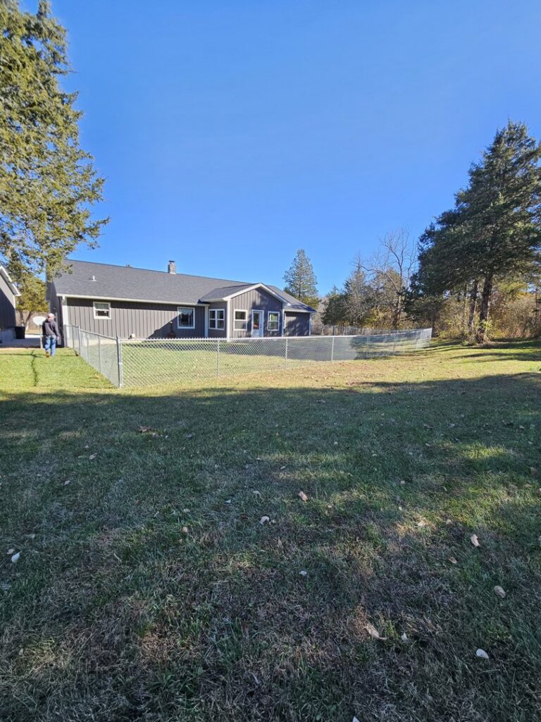 Residential backyard chain link fence installed by National Fence and Gate in Ironton, MO.