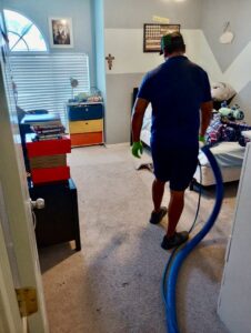 A professional cleaning residential bedroom carpet by DEEP CLEAN Carpet Cleaners in Beaverton, OR